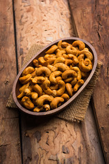 Masala Kaju or spicy Cashew in a bowl. Popular festival snack from India/asia, also known as Chakna recipe