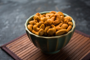 Masala Kaju or spicy Cashew in a bowl. Popular festival snack from India/asia, also known as Chakna recipe