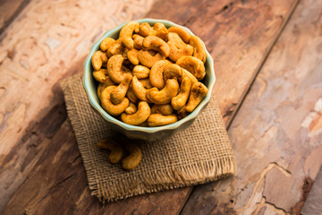 Masala Kaju or spicy Cashew in a bowl. Popular festival snack from India/asia, also known as Chakna recipe
