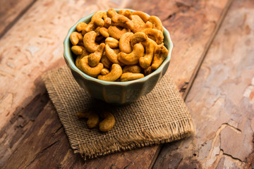 Masala Kaju or spicy Cashew in a bowl. Popular festival snack from India/asia, also known as Chakna...