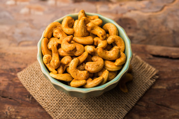 Masala Kaju or spicy Cashew in a bowl. Popular festival snack from India/asia, also known as Chakna recipe