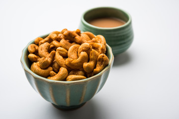 Masala Kaju or spicy Cashew in a bowl. Popular festival snack from India/asia, also known as Chakna recipe