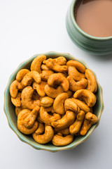 Masala Kaju or spicy Cashew in a bowl. Popular festival snack from India/asia, also known as Chakna recipe