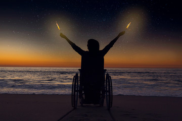 Handicapped woman holding fire sparklers