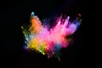 abstract colored dust explosion on a black background.abstract powder splatted background,Freeze...