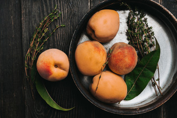 Sweet ripe peaches on the rustic background. Selective focus. Shallow depth of field.