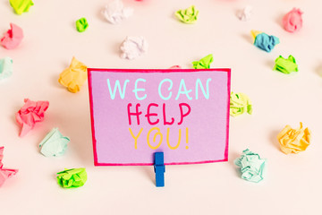 Writing note showing We Can Help You. Business concept for offering good assistance to customers or...