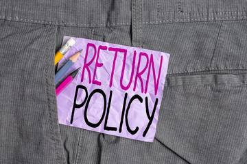 Conceptual hand writing showing Return Policy. Concept meaning Tax Reimbursement Retail Terms and Conditions on Purchase Writing equipment and purple note paper inside pocket of trousers