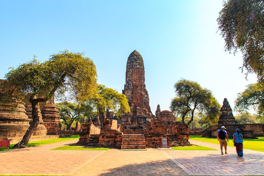 Tourists are entering the Wat Phra Ram, restored ruins located in the Historical Park of Ayutthaya in Pratu, Tailand. The monastery was constructed on the cremation.