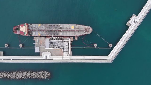 flycam films tremendous tanker attached to narrow berth