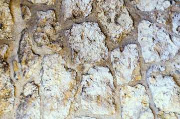 Multicolored abstract illustration on an old stone wall. Natural background concept