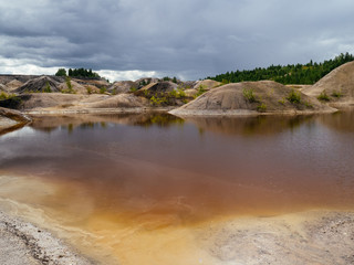 Natural clay quarry. Red lake because of the clay