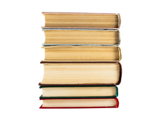 A stack of books of different colors with aged yellow pages
