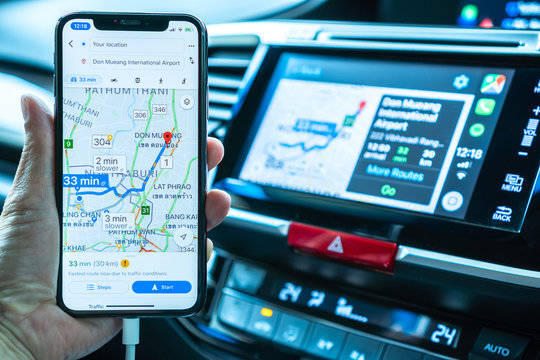 BANGKOK, THAILAND-16 May, 2019: Google map on Apple CarPlay app on iPhone X smart mobile application connected to Honda car for online gps road travel map, transportation vehicle safety