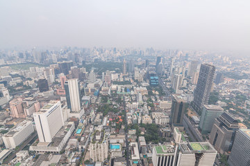 Fototapeta na wymiar Air pollution in Bangkok with PM2.5 air-quality index (AQI) reached dangerous level with dust and smog in hazy sky, threatening to public health, rooftop view