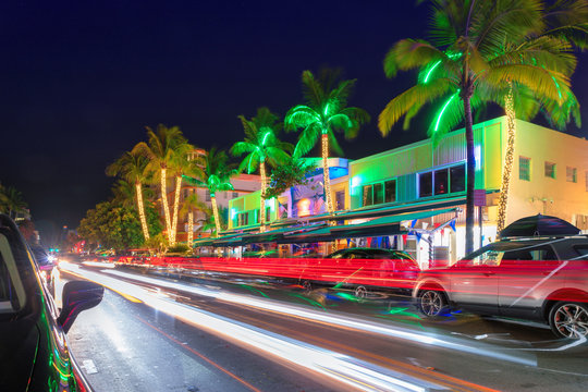 Night view of Ocean Drive in Miami Beach, Florida - hotels and restaurants at sunset on Ocean Drive, world famous destination.