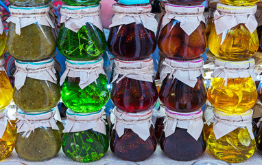 Jars of jam from various berries and fruits. Assortment of jams.