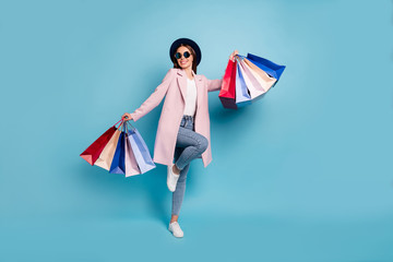 Full body photo of enthusiastic candid lady in eyewear eyeglasses go shopping buy purchases wear...