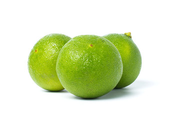 Fresh green lime with drops isolated on white background with clipping path.