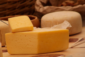 piece of cheese on wooden board