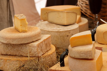 various types of cheese on wooden table