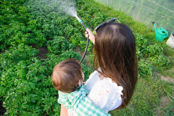 mom and son hose home crops. eco food. without additives. healthy food for the baby.