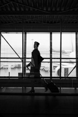 Fototapeta na wymiar silhouette of flight attendant in airport
