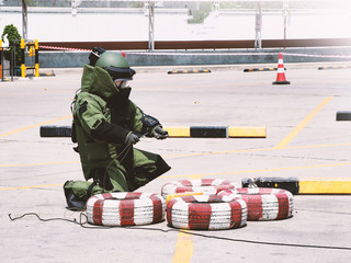 Bomb Disposal Expert in Bomb suit for Explosive ordnance disposal