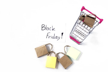 Fototapeta premium shopping cart and shopping bags on white background black friday sale shopping