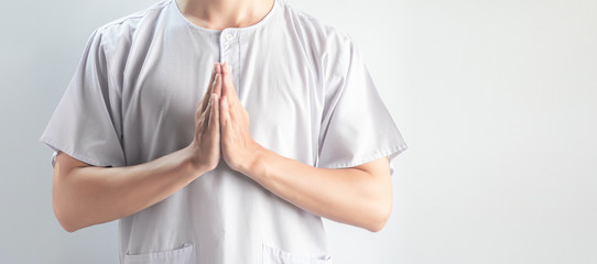 Praying hands of Asian men wearing white casual cloth isolated on white background, Religion and meditation concept