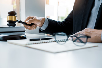The private office workplace for consultant an young lawyer legislation with gavel and document on...