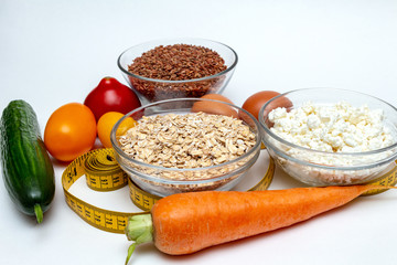 buckwheat, cereals, measuring tape, farm cottage cheese, carrot, egg, tomatoes, cucumber close up on white background protein healthy diet fat free concept eco product sports nutrition