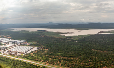 Aerial panoramic view of suburbs of Gaborone city surrounded by savannah and lake in the...