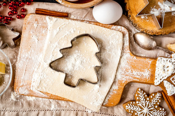 cooking christmas gingerbread on wooden background top view