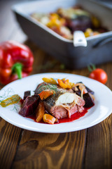 fish stew with beets and other vegetables in a plate