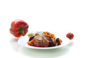 fish stew with beets and other vegetables in a plate