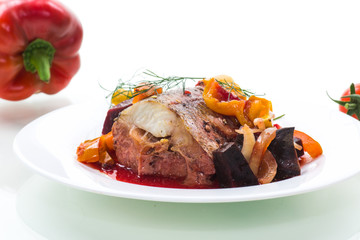 fish stew with beets and other vegetables in a plate