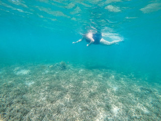 Diving woman and underwater background. 