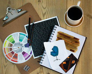 Naklejka premium Flat lay of Interior designer work space with sketches, tools and colour chart