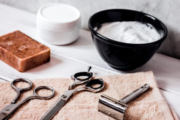 Mens hairdressing wooden desktop with tools for shaving
