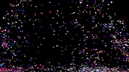 A fountain of colorful confetti falling on the floor on an black background