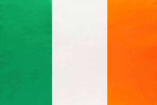 Ireland national fabric flag with emblem, textile background.