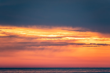 Fototapeta na wymiar Beautiful red and orange sunset over the sea.