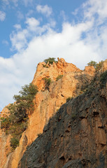 Red mountain and blue sky with white clouds