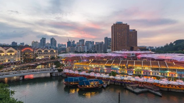 Singapore time lapse 4K, city skyline day to night timelapse at Clarke Quay business district 