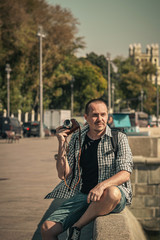 Man holding retro camera. Vintage camera. Photographer.