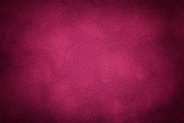 Dark purple matt suede fabric closeup. Velvet texture.
