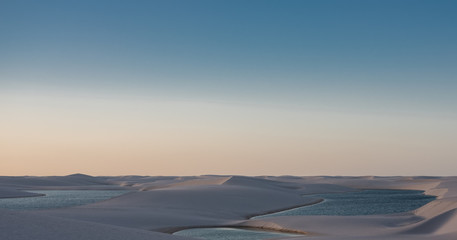 Fototapeta na wymiar Lençois Maranhenses oasis lake in desert with sand dunes sunset 
