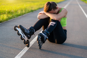Woman injured knee while rollerblading. A teenager having a bruise after falling while inline...