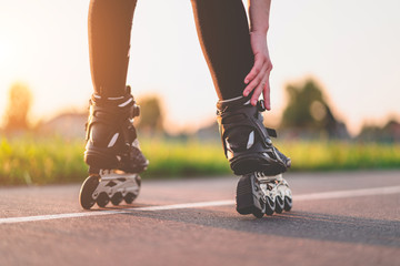 Woman in roller skates during inline skating outdoors. Active lifestyle. Teenager during...